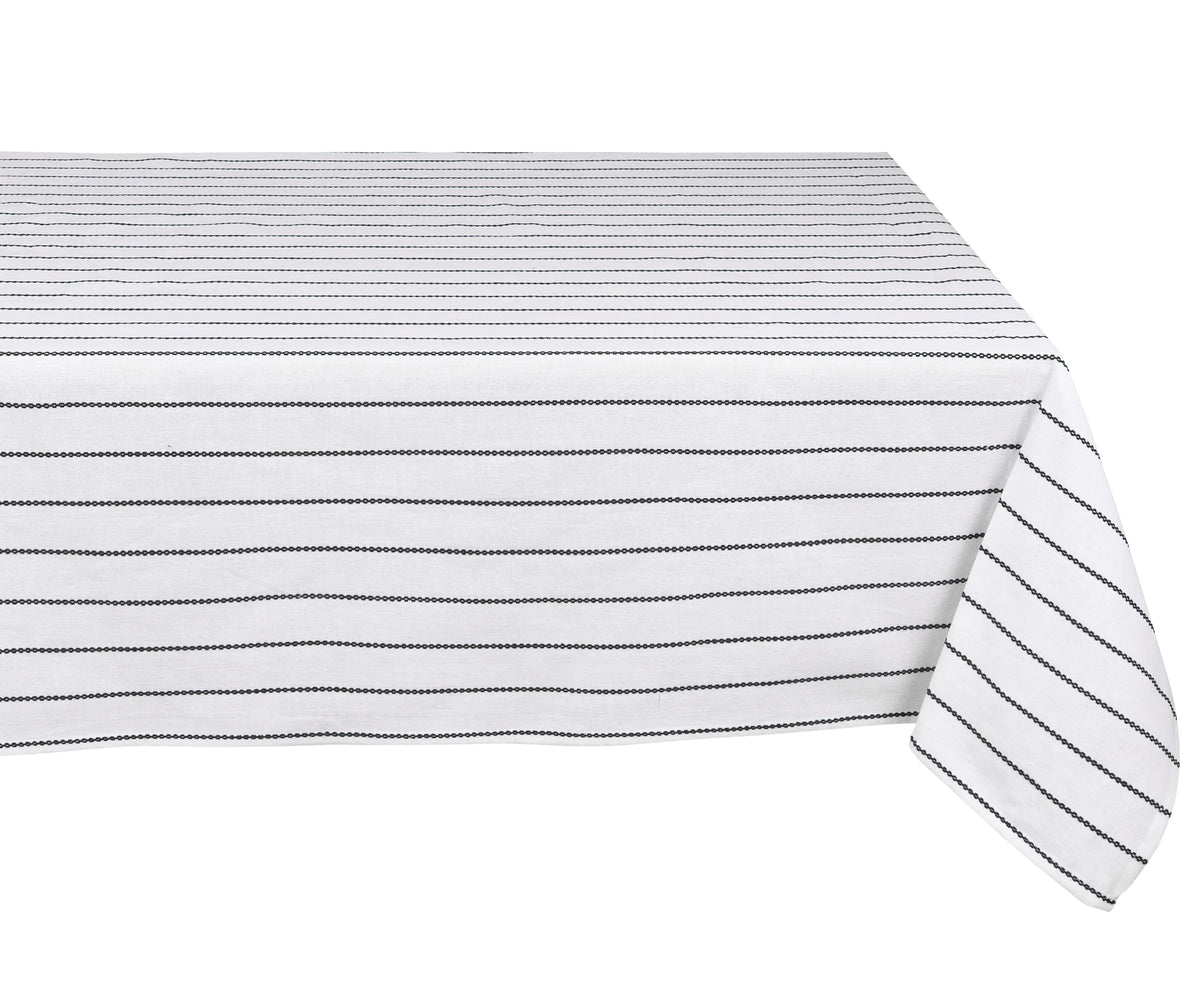 Black and white cotton rectangular tablecloth on dining table