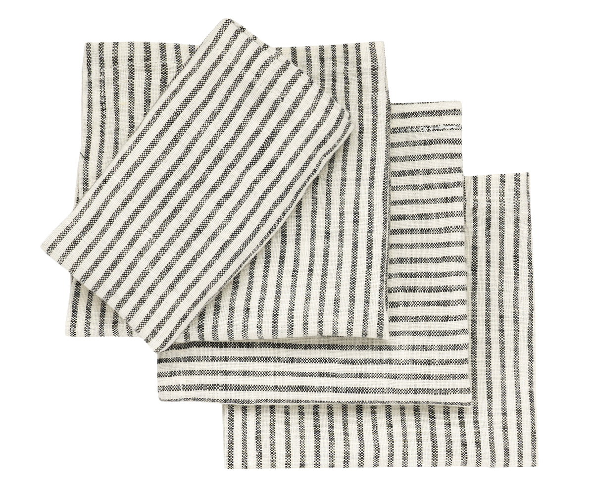 Set of black and white striped napkins styled for a wedding table setting