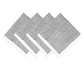 Hand-block printed napkins folded beside ceramic dinnerware	