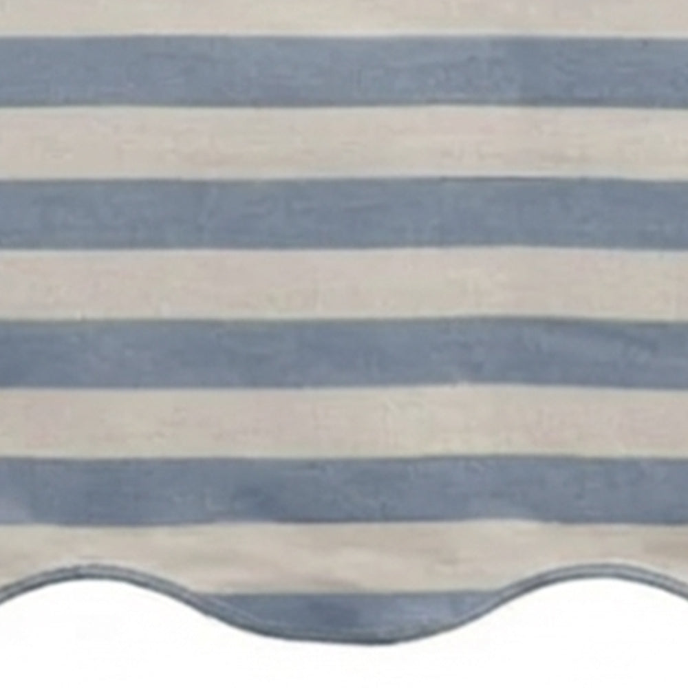 Blue and white cabana striped table runner with a scalloped edge detail.