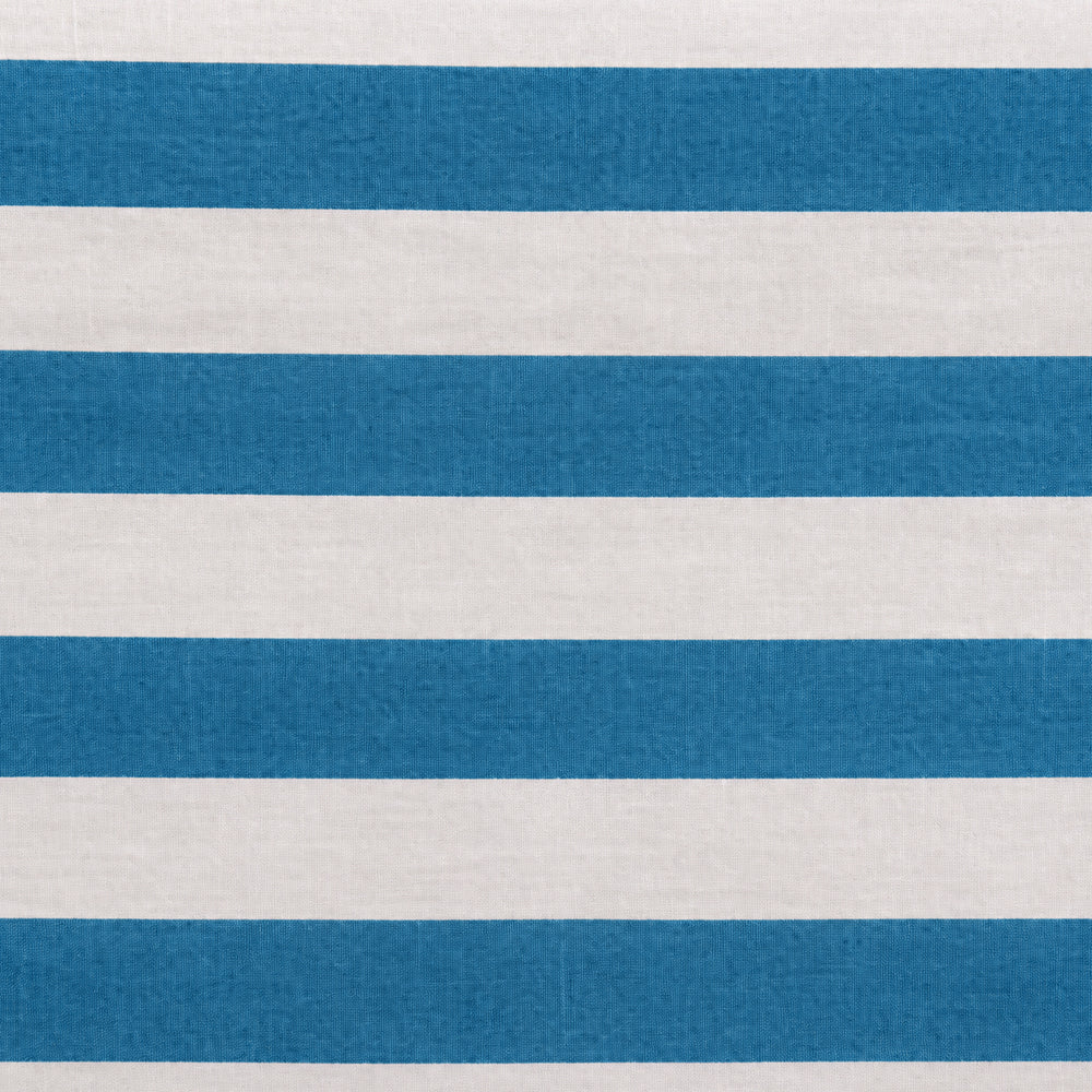 Close-up fabric swatch of a blue and white cabana stripe cotton table napkin