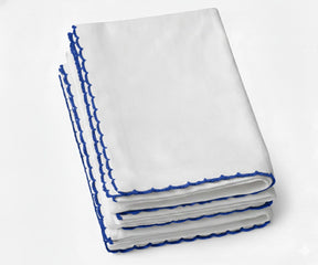 White cotton napkin with colorful embroidered edge for parties