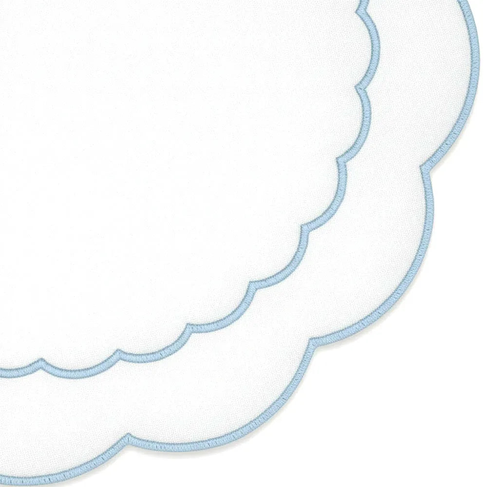 Round blue cotton placemat featuring scalloped edges and detailed embroidered peony design