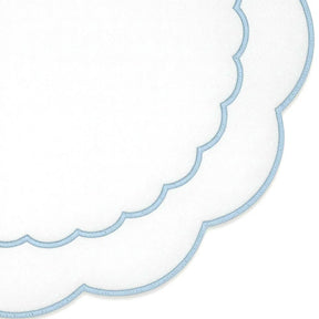 Round blue cotton placemat featuring scalloped edges and detailed embroidered peony design