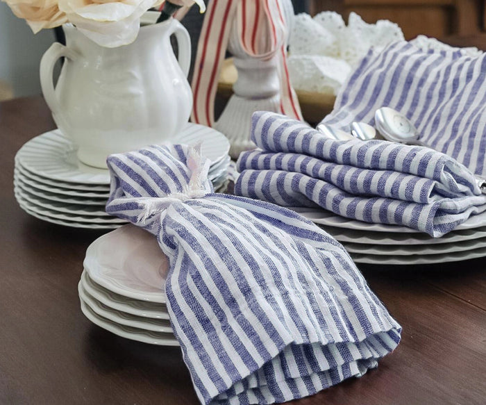 Luxury blue pinstripe linen dinner napkins designed for upscale dining tables, weddings, and formal entertaining