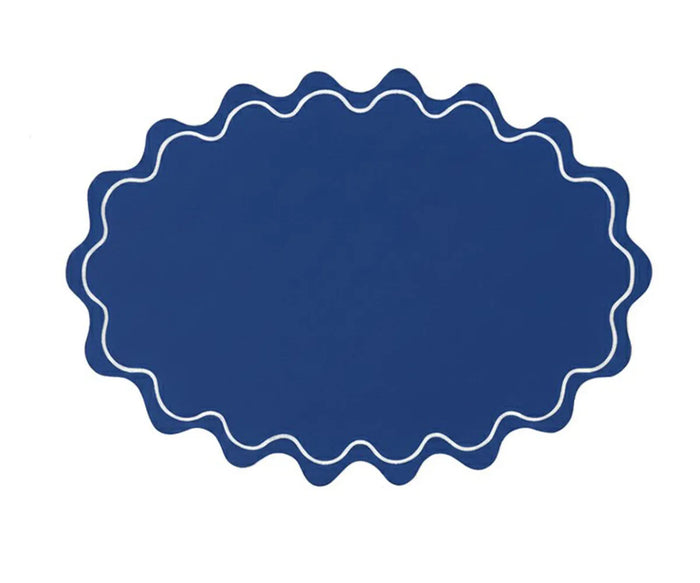 Premium cotton oval placemat featuring a soft wavy silhouette and classic scalloped border for timeless décor