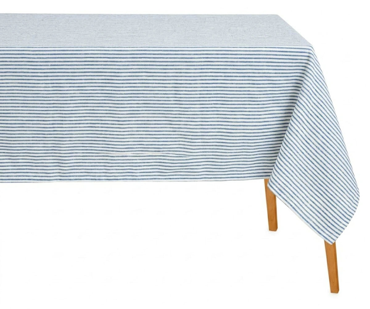 Rectangular blue and white horizontal striped cotton tablecloth on a wooden table with a white background.