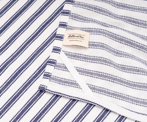 Blue and white striped towels paired with plain tablecloths and napkins