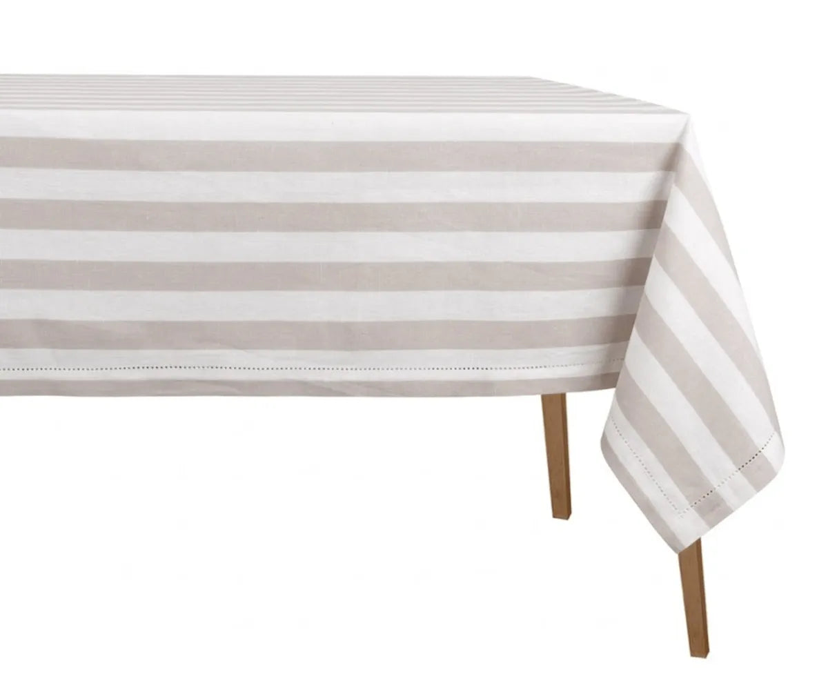 Striped cotton linen tablecloth draped on a rectangle dining table in a modern dining room setting