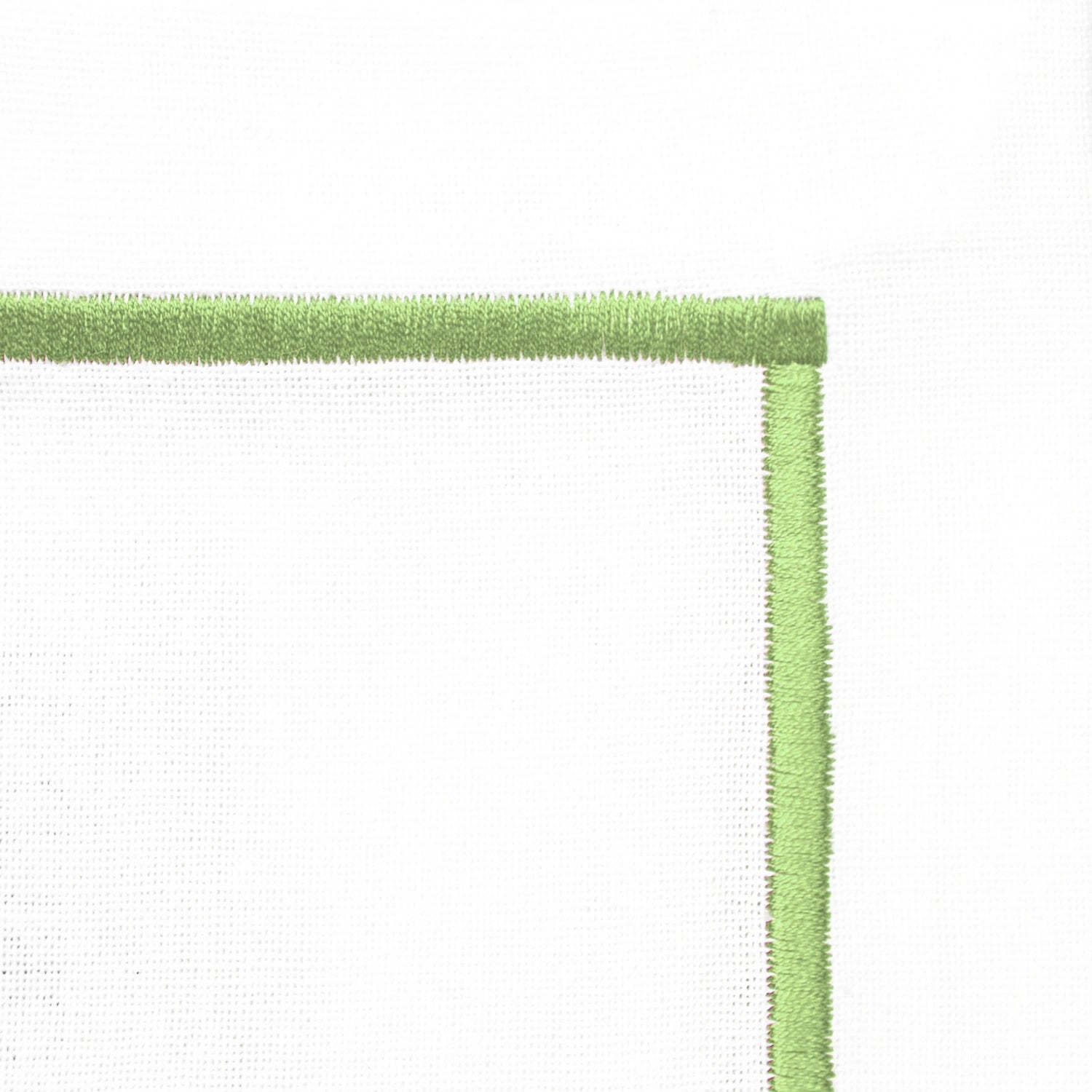 Embroidered sage green cotton placemat set with elegant line detailing,