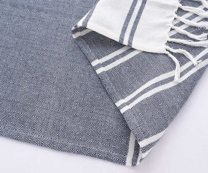 Elegant navy Turkish towels folded neatly for beach, spa, or travel use