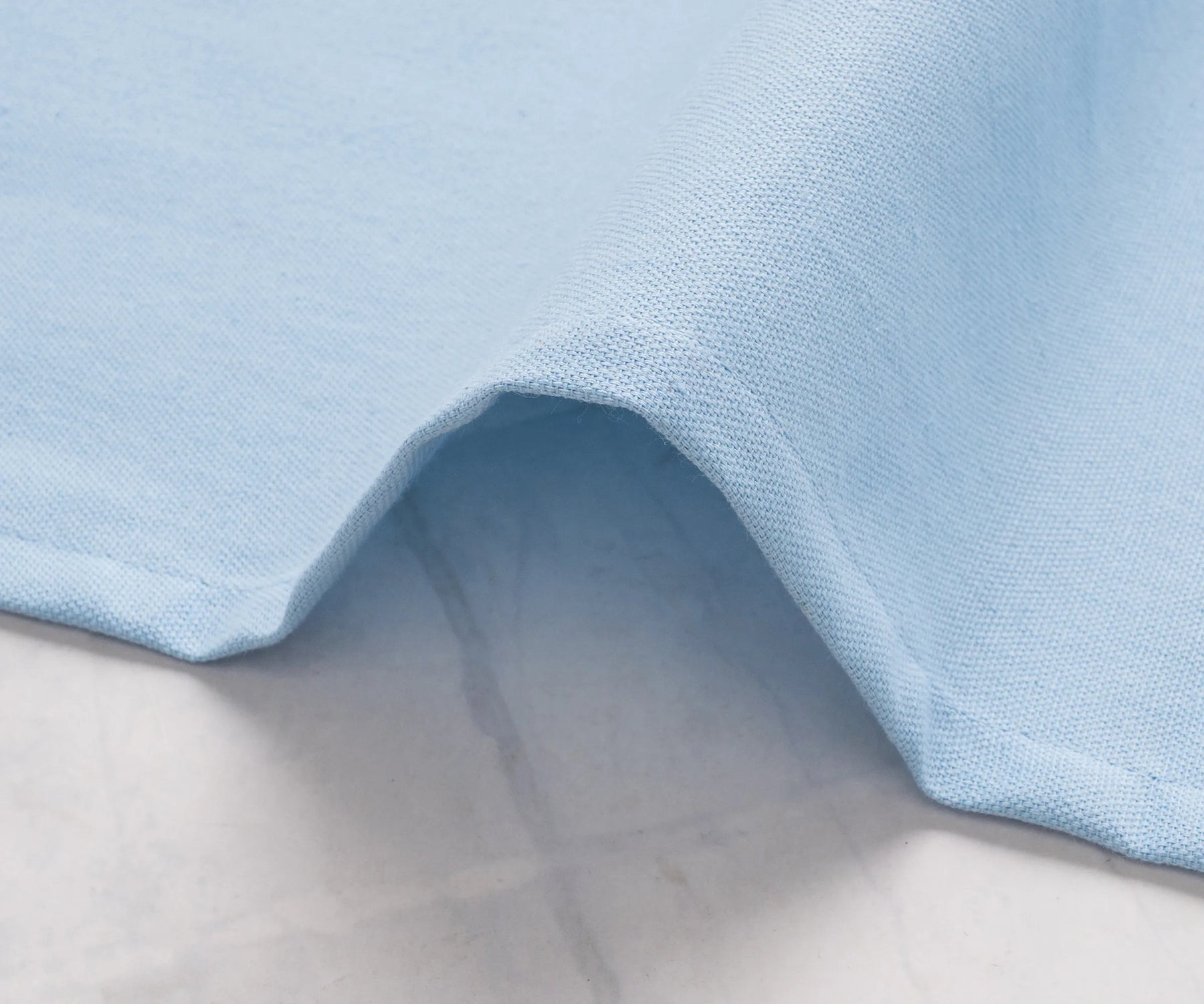 Bulk cotton napkins in pale blue for weddings or events