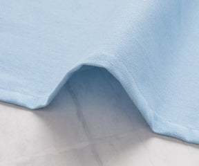 Bulk cotton napkins in pale blue for weddings or events