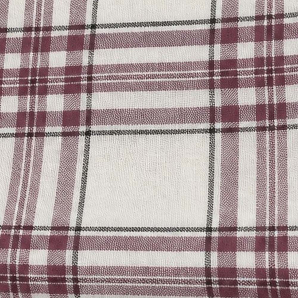 Close-up fabric swatch of off-white woven cotton fabric with a burgundy and black tartan plaid check pattern.