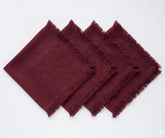 Set of cotton cloth napkins featuring decorative fringe edges, designed for sustainable dining and long-lasting everyday use.