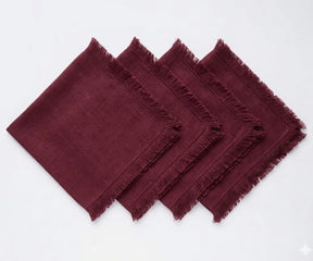 Set of cotton cloth napkins featuring decorative fringe edges, designed for sustainable dining and long-lasting everyday use.