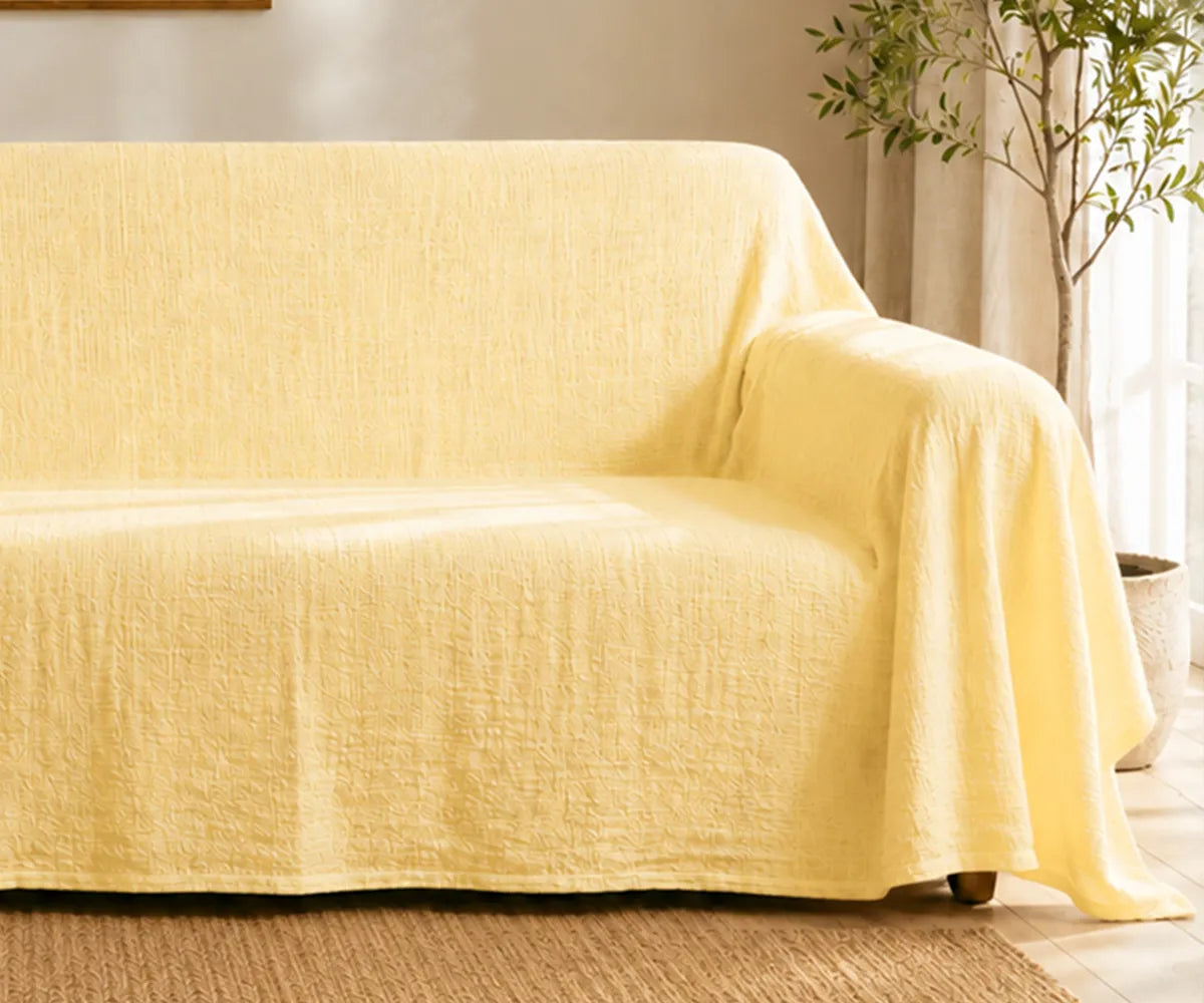 Plain linen couch cover with a relaxed look for modern, farmhouse, and minimalist home décor.
