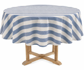 A round table covered with a blue and off-white striped tablecloth, shown on a light wood pedestal table against a plain white background.