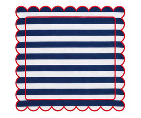 Navy and white striped cloth napkin with scalloped edges and red trim for coastal dining table decor