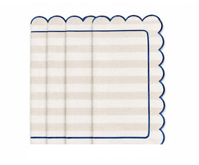 Ivory and white striped cloth napkin with scalloped edges and navy trim for elegant neutral table decor