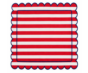 Red and white striped cloth napkin with scalloped edges and navy trim for classic dining table decor