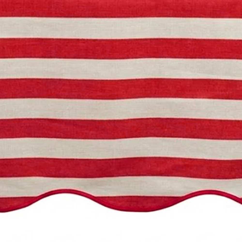Red and white striped awning with scalloped edge