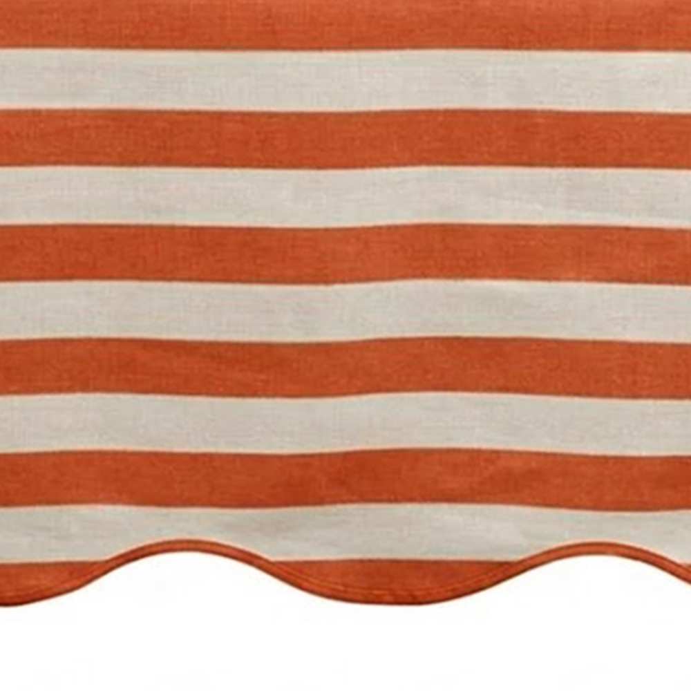 Orange and white striped awning with scalloped edge