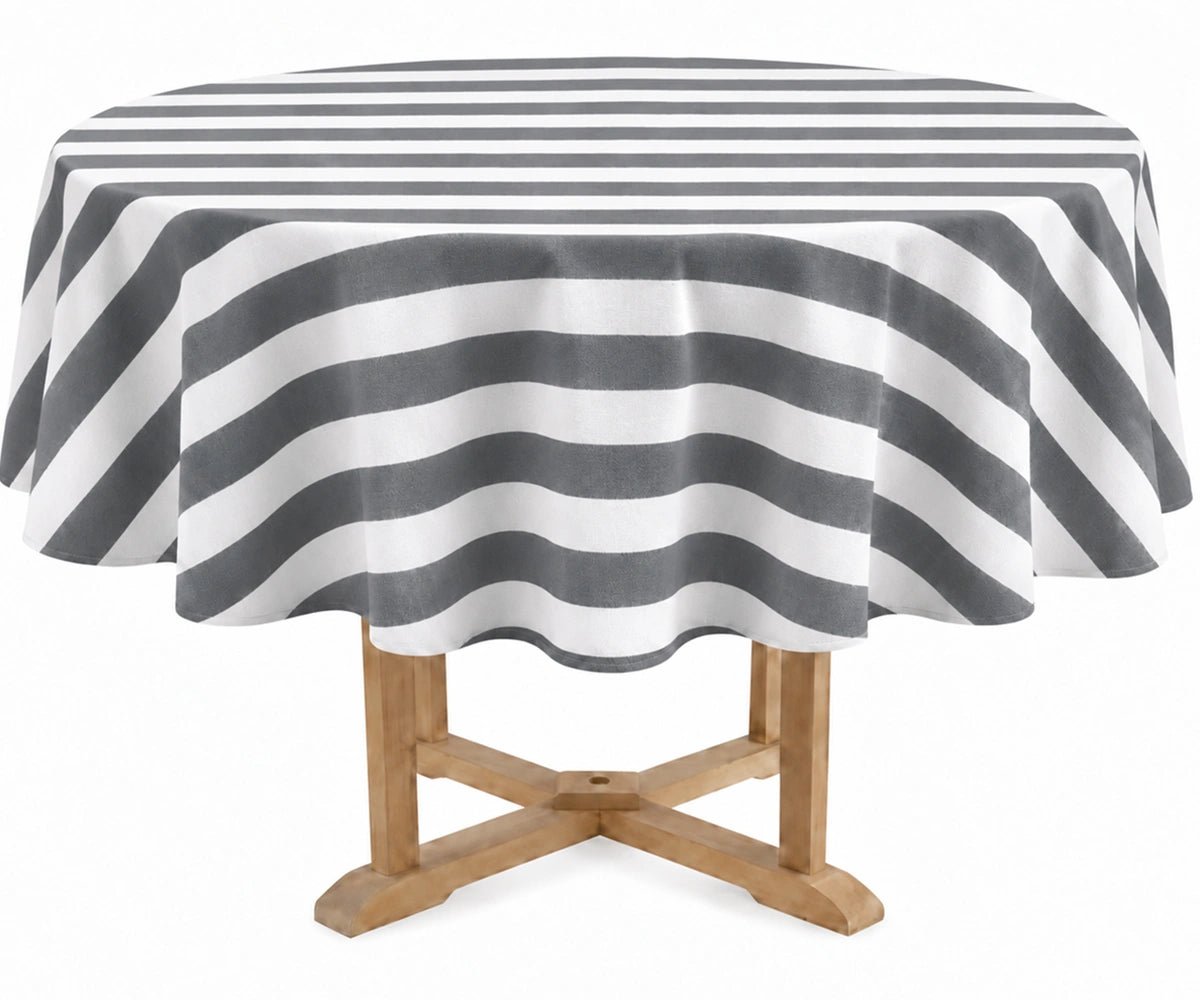 A round table covered with a charcoal and off-white striped tablecloth, shown on a light wood pedestal table against a plain white background.
