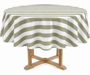 A round table covered with a sage and off-white striped tablecloth, shown on a light wood pedestal table against a plain white background.