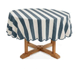 Ocean blue and white cabana striped round tablecloth with scalloped border, cotton linen blend table cover for coastal décor, summer entertaining, outdoor dining, and family gatherings