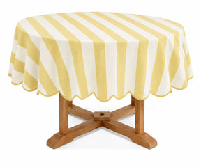 Butter yellow round cotton tablecloth with a soft warm tone for cheerful and inviting dining decor
