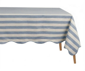  Light Blue and white cabana striped tablecloth with a scalloped edge on a wooden table.