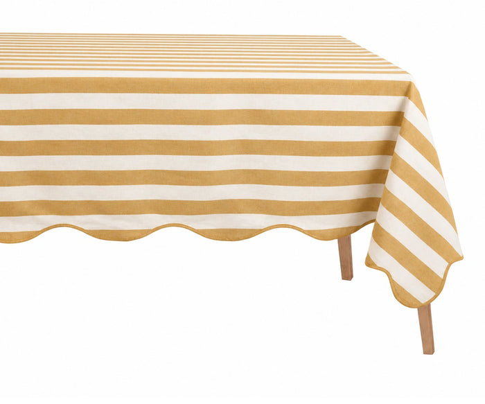 Yellow and white striped tablecloth on rectangular table