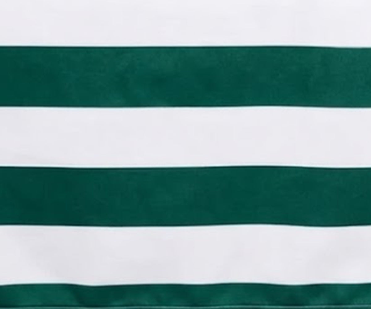 Close-up of  green and white small checkered cotton tablecloth with a decorative stitched scalloped edge border.