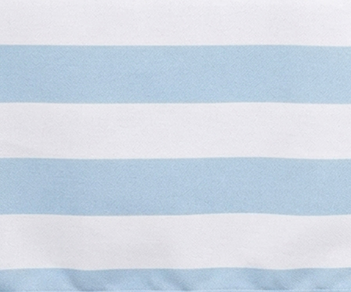 Close-up fabric view of a Pale blue and white wide cabana striped cotton  tablecloth.