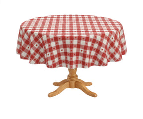 Red and white gingham round tablecloth on wooden pedestal table
