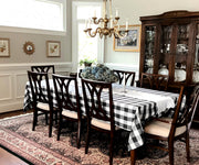 Dining area setup with a chic black and white buffalo plaid tablecloth