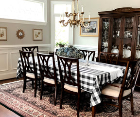 Dining area setup with a chic black and white buffalo plaid tablecloth