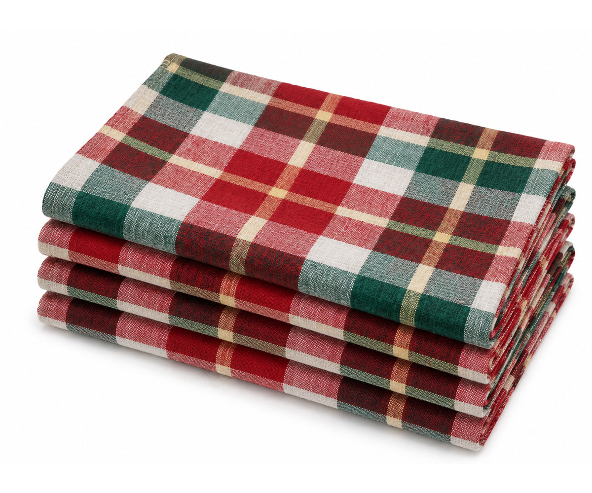 Folded stack of red and green tartan plaid woven cotton cloth dinner napkins