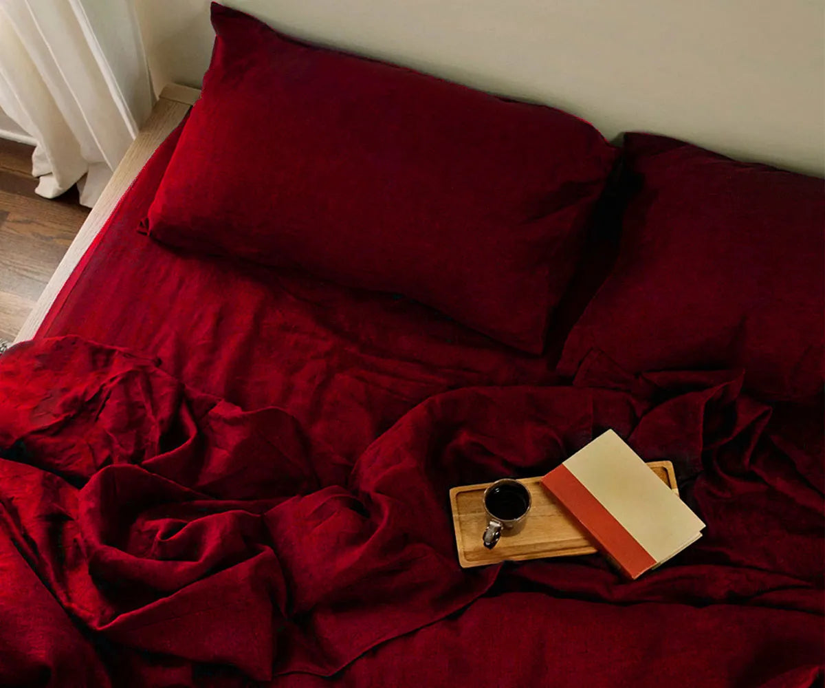 Cherry red linen bedding set on bed