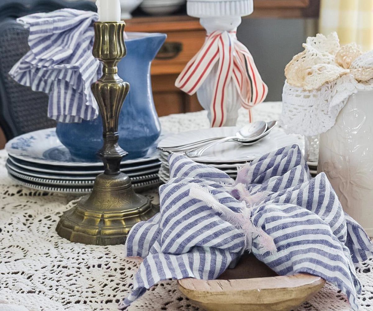 Coastal inspired blue pinstripe linen napkins bringing fresh seaside elegance to wedding and event tables
