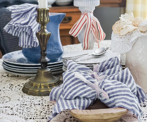 Coastal inspired blue pinstripe linen napkins bringing fresh seaside elegance to wedding and event tables