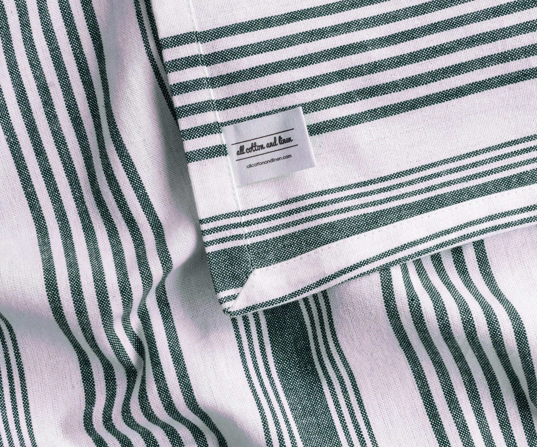 Green and white striped cotton tablecloth for everyday family meals and brunch