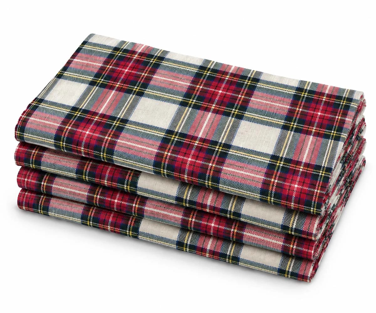 Stacked set of 4 cloth napkins with a classic red, green, and cream tartan plaid pattern
