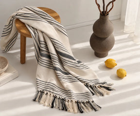 Black and white striped cotton throw blanket for holiday entertaining and winter home styling