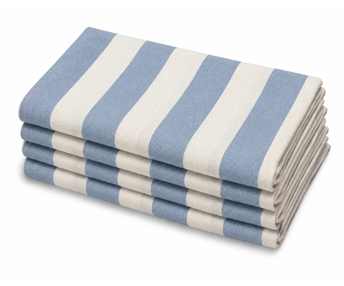 A stack of four folded fabric table napkins with vertical stripes in dusty blue and white, shown on a clean white background.