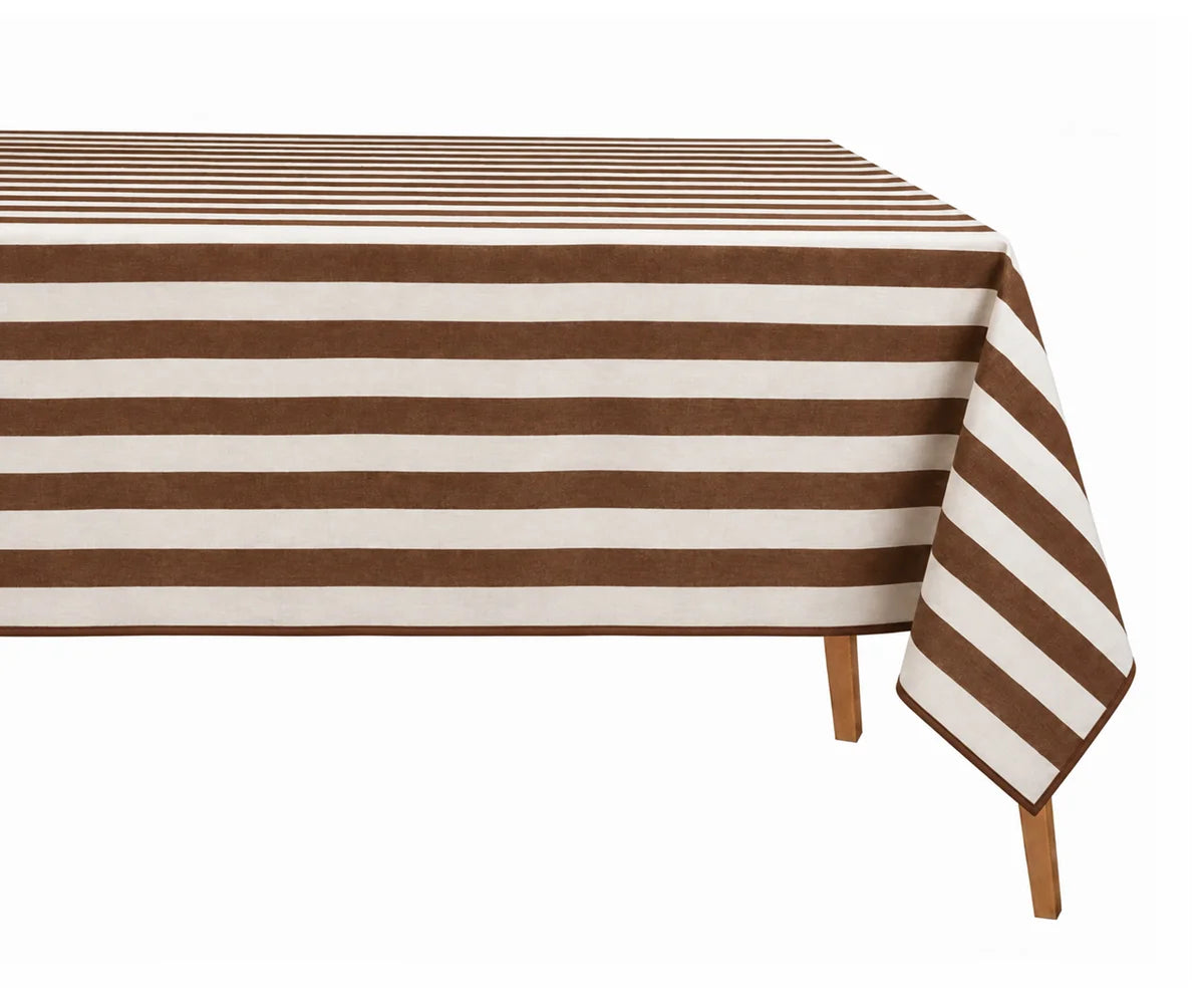 A rectangular table covered with a striped tablecloth featuring alternating medium brown and off-white horizontal stripes, shown against a plain white background with the table legs visible underneath.