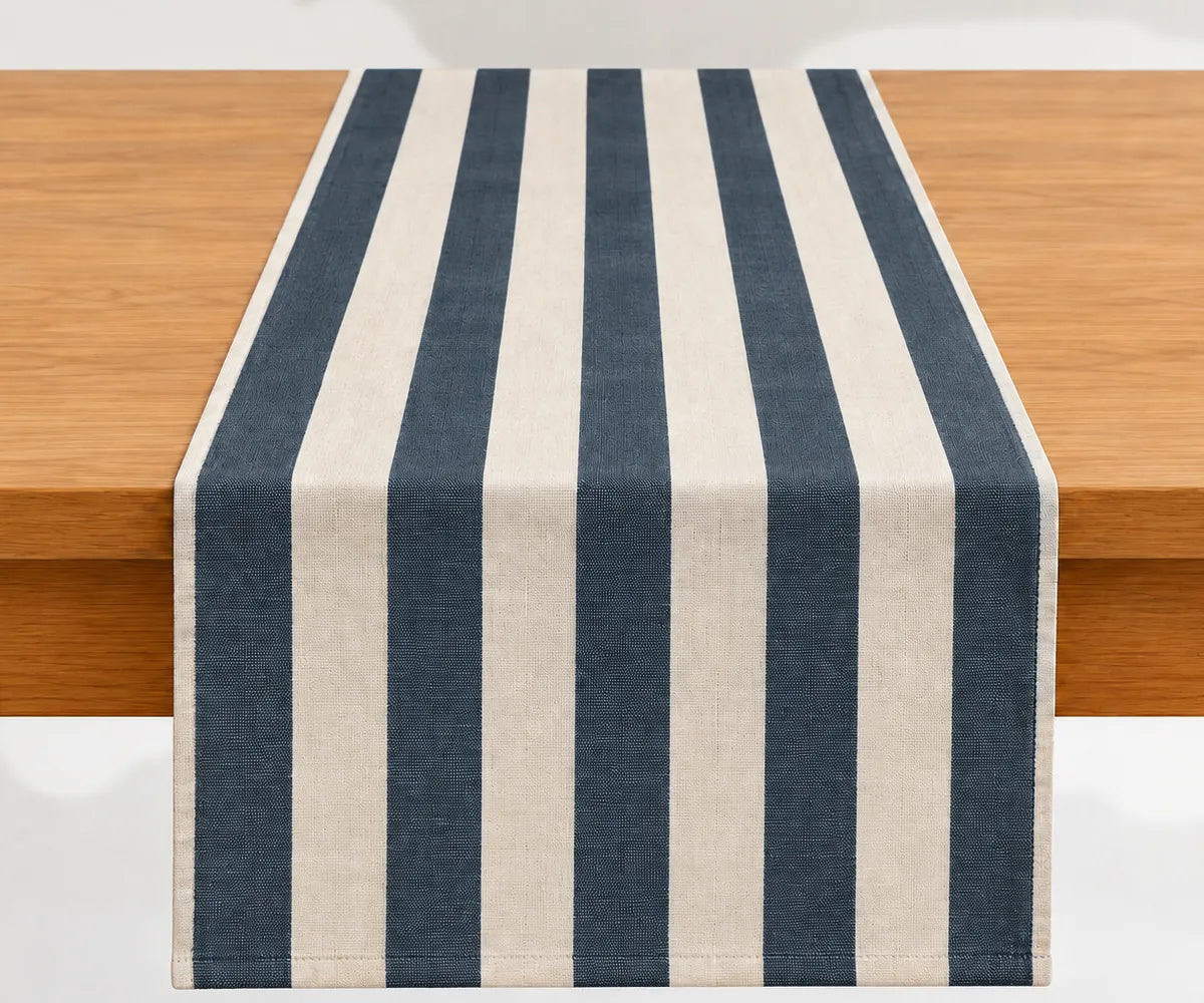 Cotton table runner featuring a timeless striped pattern, washable construction, and versatile sizing for dining tables