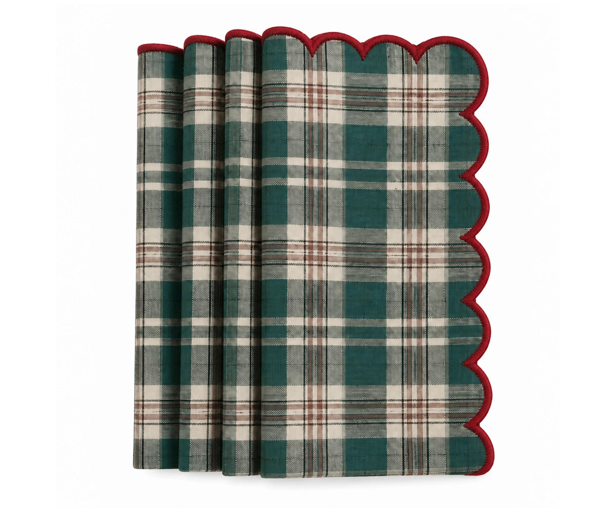 Green plaid holiday napkin with red scalloped border, decorative Christmas table napkin for festive dinners, family meals and seasonal table settings.