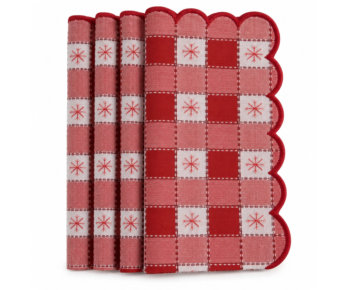 Red and white Christmas plaid cloth napkin with scalloped edge, festive snowflake pattern for holiday dinner table and Christmas table setting.